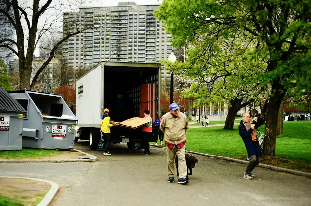 Removalists unloading furniture from a truck
